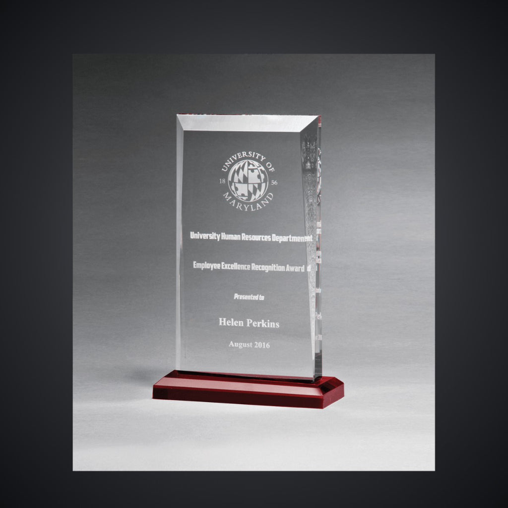 5" x 7 3/4" Apex Clear Acrylic Award with Red Highlights and Red Base, laser engraved with a sample name and logo layout