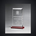 5" x 7 3/4" Apex Clear Acrylic Award with Red Highlights and Red Base, laser engraved with a sample name and logo layout
