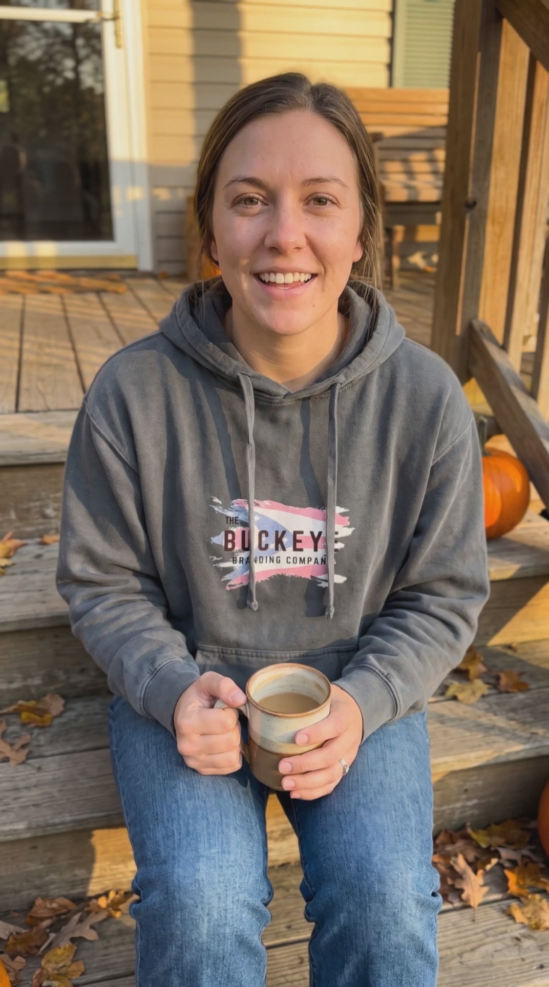 Customer wearing a custom Comfort Colors garment-dyed hoodie from Buckeye Branding Company, Copley OH